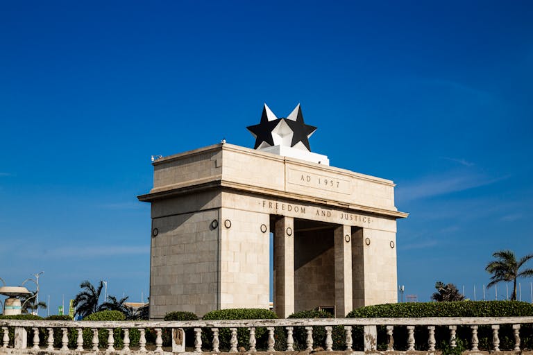 Stunning view of Independence Arch against a clear blue sky in Accra, Ghana.